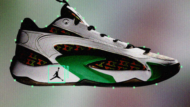 Side view of Luka Doncic's white, black, and green Jordan Brand sneaker.